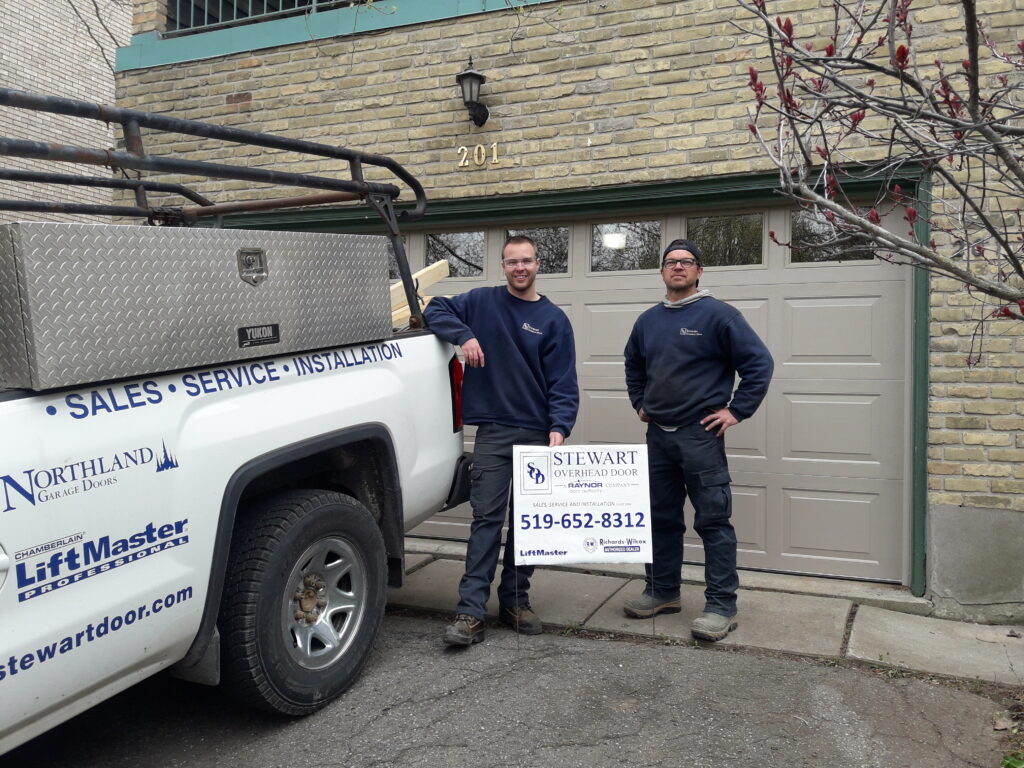 Daniel & Dan with lawn sign
